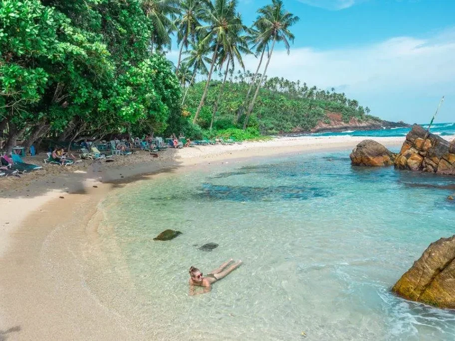 The sheltered shoreline at Secret Beach near Mirissa